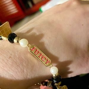 Handmade from an authentic Juicy Couture bracelet making kit. Stretchy string.